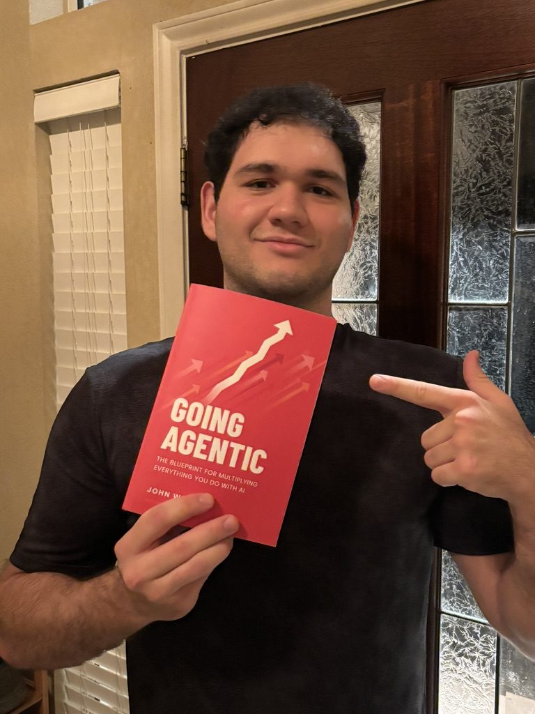 A reader pointing at his copy of Going Agentic