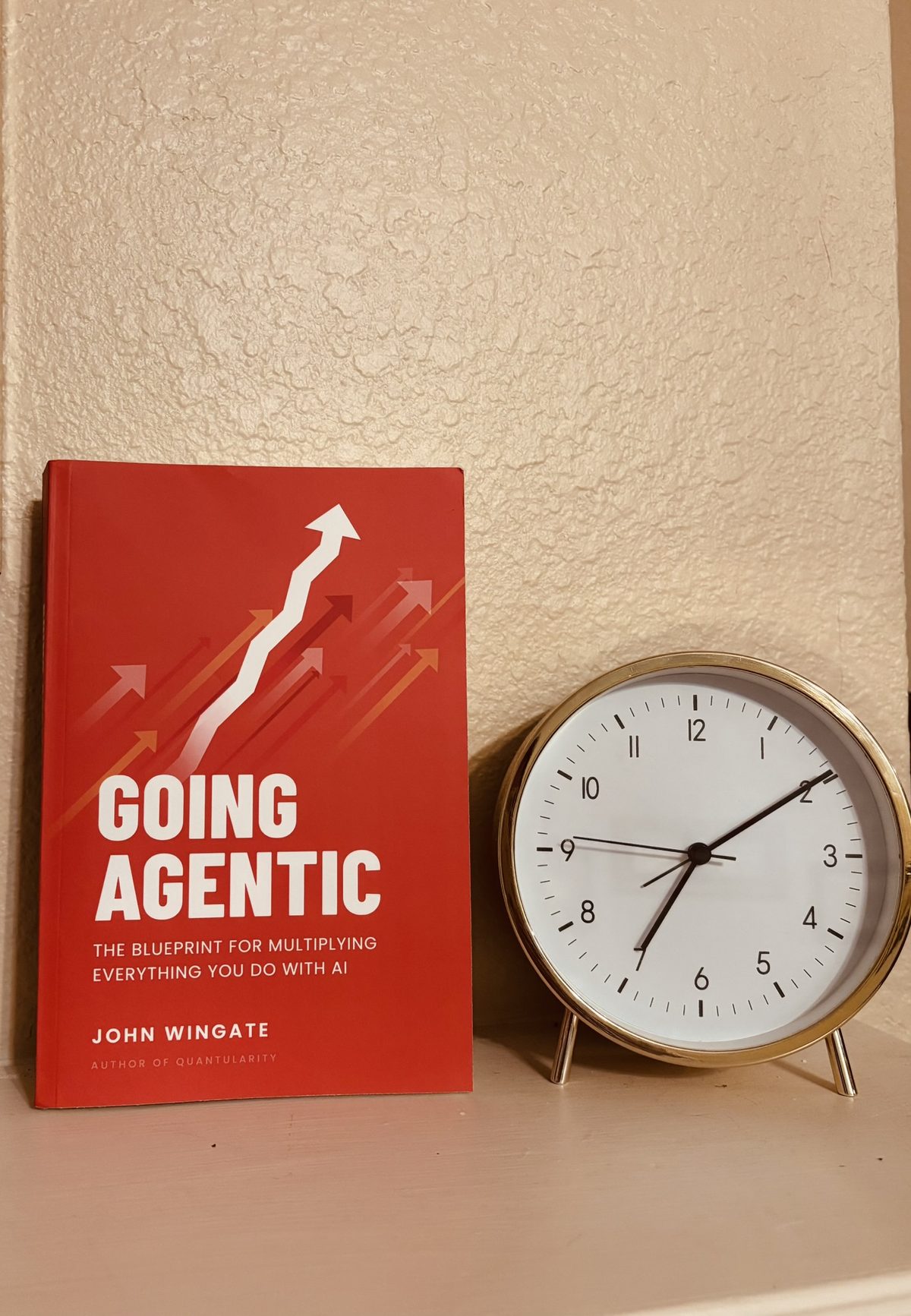 Going Agentic standing beside a clock