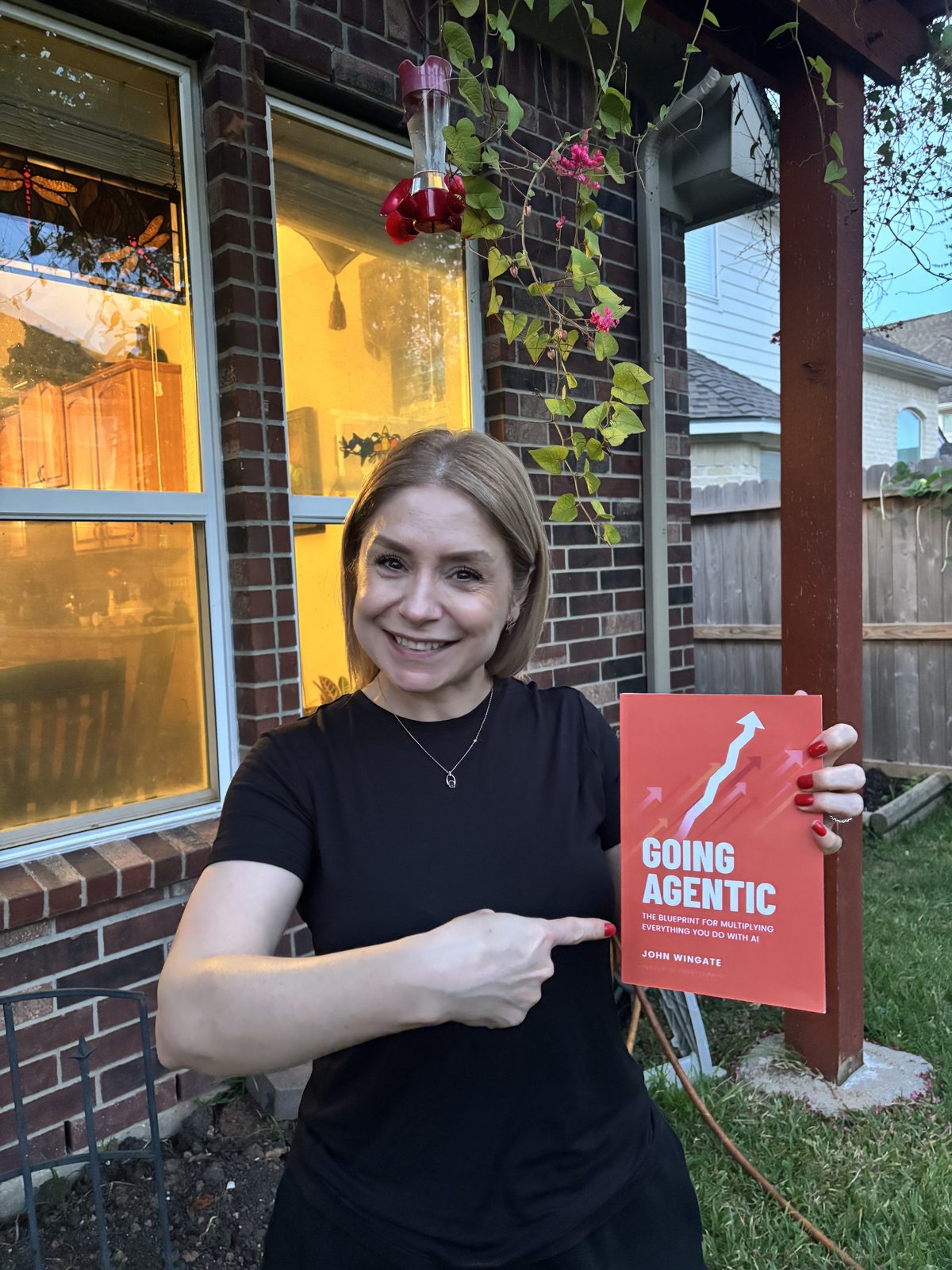 A reader pointing at her copy of Going Agentic