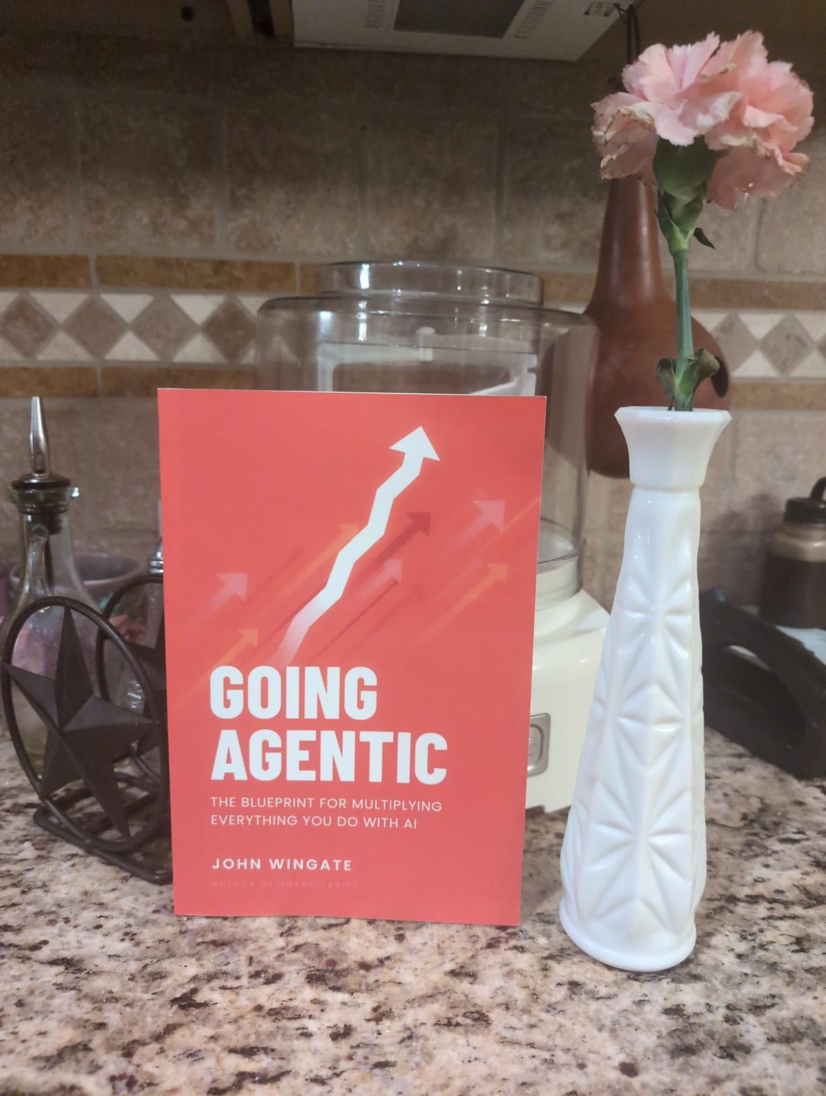 Going Agentic on a kitchen counter beside a flower