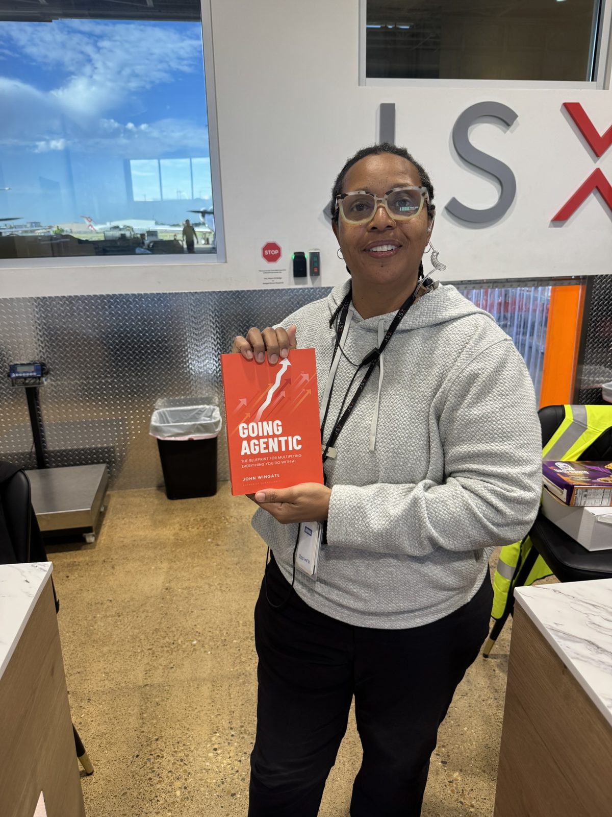 A JSX crew member holding Going Agentic