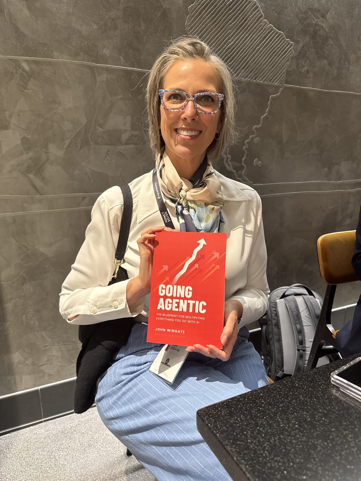 A reader with Going Agentic, seated at an event