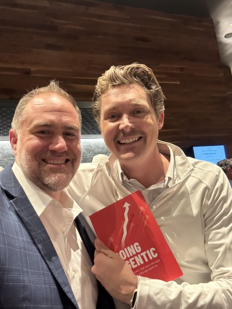 Two readers smiling with Going Agentic