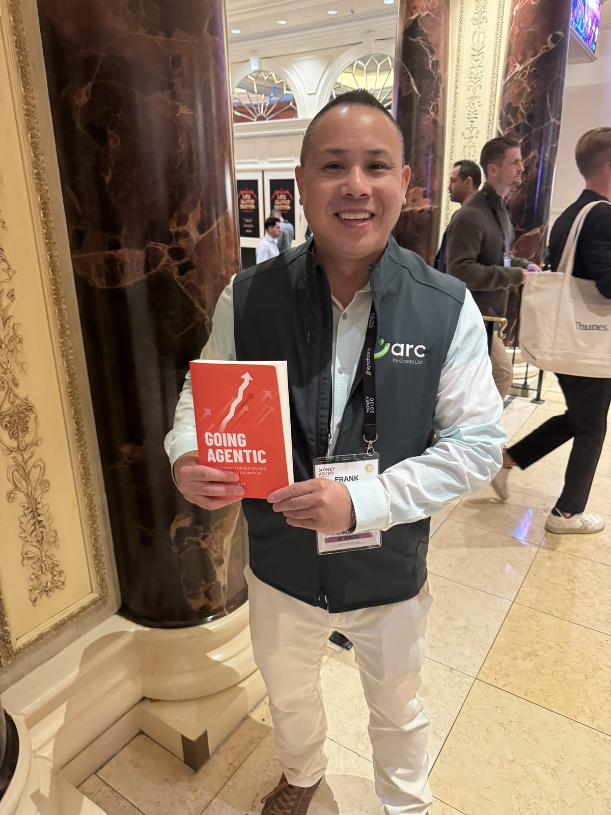 A reader with Going Agentic at a conference