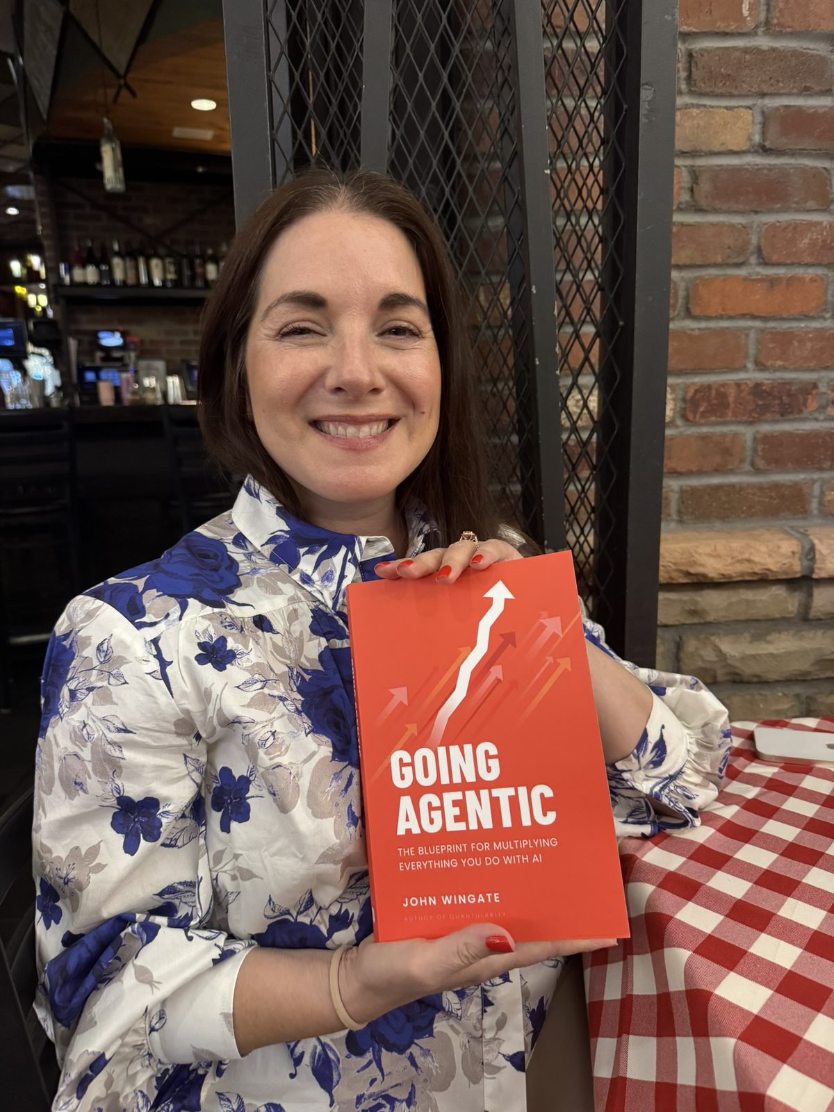 A reader with Going Agentic at a restaurant