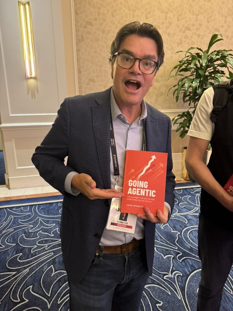 A reader with Going Agentic at an event