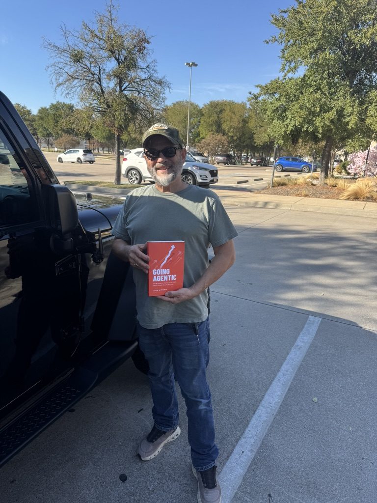 A reader with Going Agentic in a parking lot